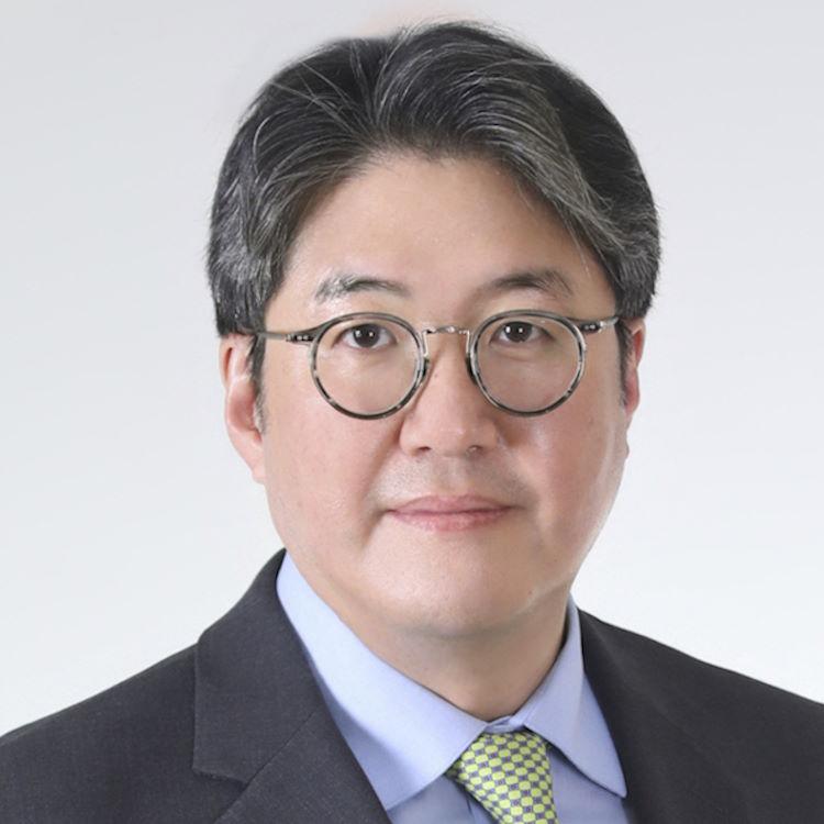 Sunghack Lim in light blue dress shirt, light green tie and dark grey suit jacket